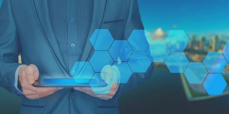 Business professional using tablet to manage security operations center SOC strategy