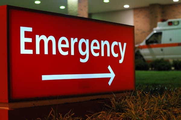 Red “Emergency” sign with arrow pointing right, symbolizing urgent response needed—paralleling fast action required when a site is hacked.
